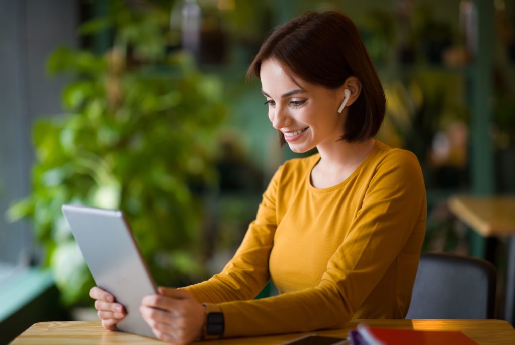 local seo - woman looking at business listings on her tablet