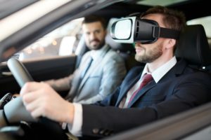 VR/AR - man wearing VR goggles in a car