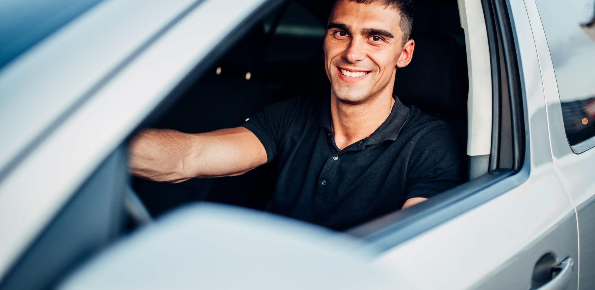 male driver in dealership advertising campaign